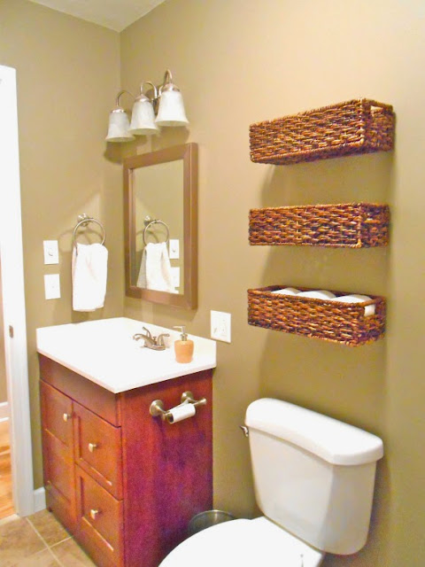 Use baskets for organizing over the toilet in the bathroom:: OrganizingMadeFun.com
