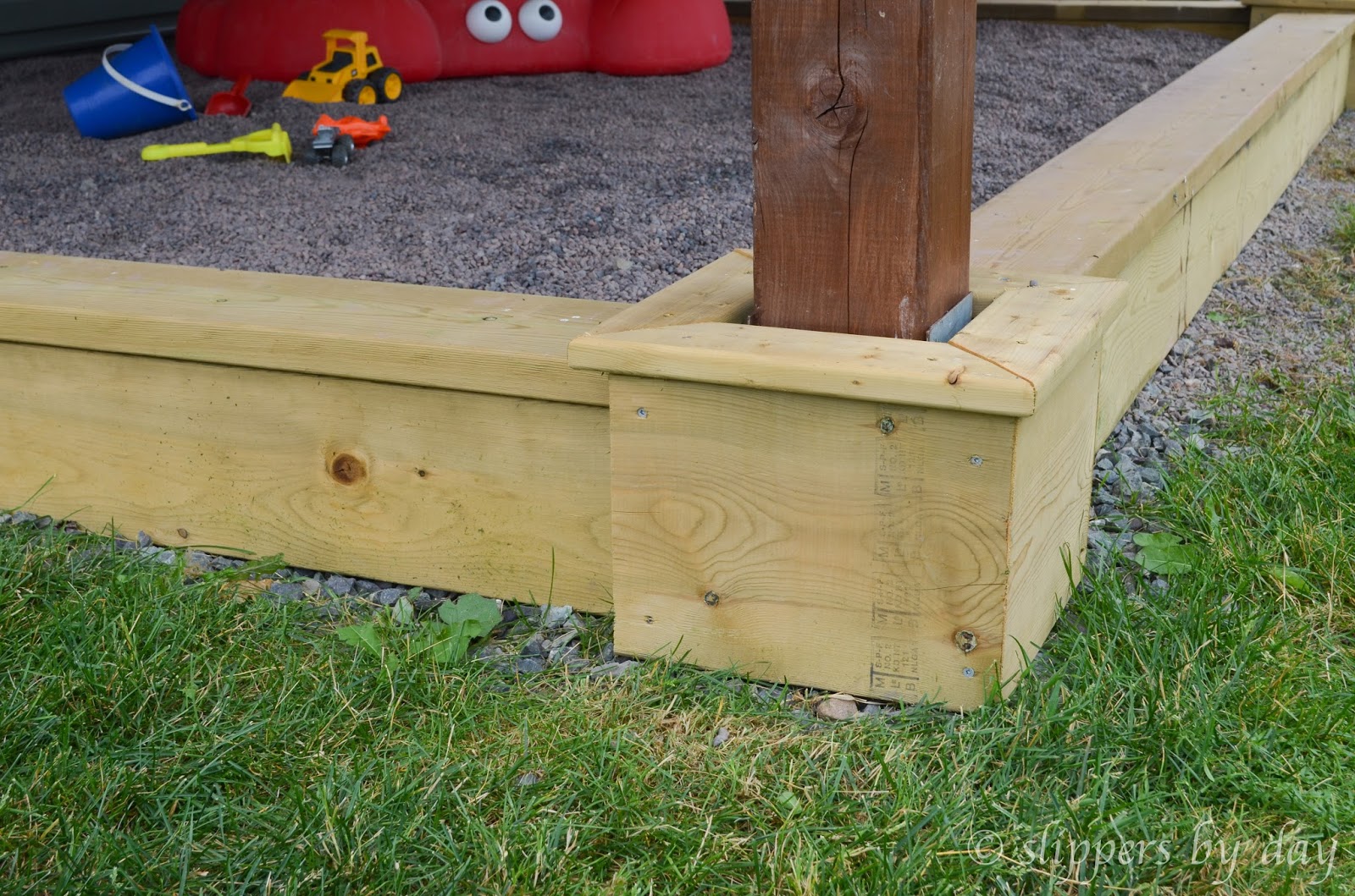 Slippers by Day DIY Sandbox Beneath a Raised Deck