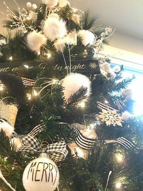 Black and white Christmas tree with handmade ornaments.