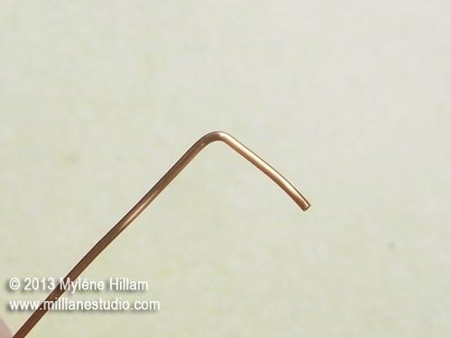 Wire bent at a 90° angle approximately 1cm from the end of the wire.