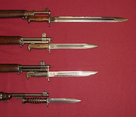 U.S. military bayonets; from the top down, they are the M1905 Bayonet, M1 Bayonet, M1905E1 Bowie Point Bayonet (cut down version of the M1905), and the M4 Bayonet for the M1 Carbine.