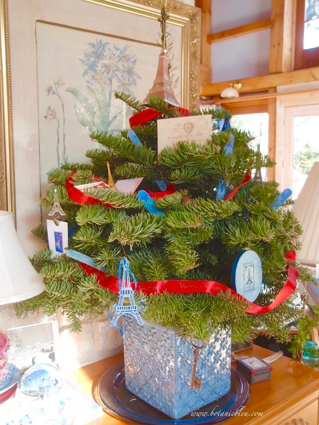 Create a live tabletop Christmas tree by cutting the top out of a five foot tree