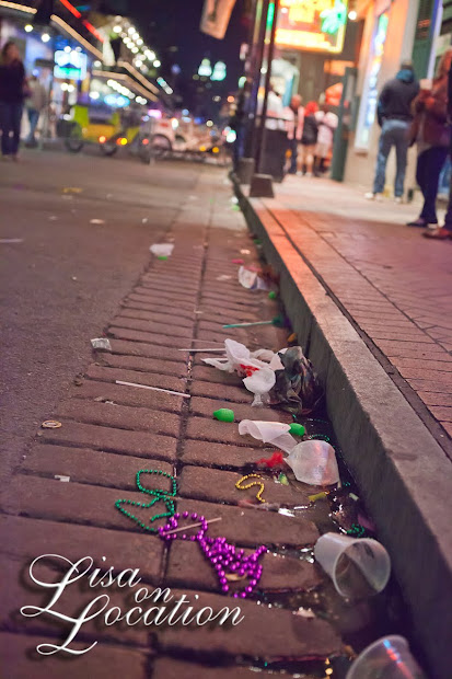 Discarded beads and litter filled the gutters of Bourbon Street in the French Quarter