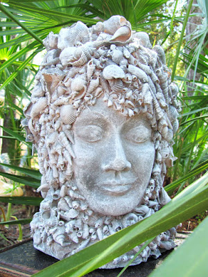 clay goddess bust with shells