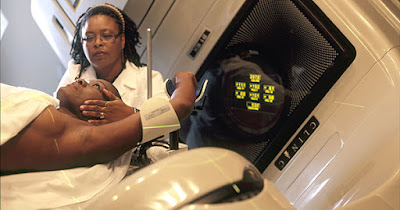African American patient receiving radiation therapy