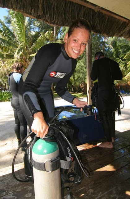 photo of Ellis with a dive tank after a dive on Dominican Republic