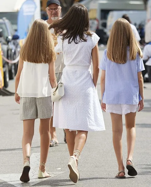 Queen Letizia wore Adolfo Dominguez embroidered cotton dress and Mint & Rose shoes.Crown Princess Leonor and Infanta Sofia