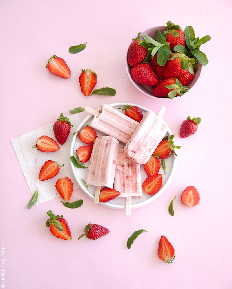Strawberries and Cream Popsicles Recipe - an easy, delicious dessert using fresh strawberries that's perfect for warmer days or a summer party! by BirdsParty.com #popsicles #icecream #strawberriescream #popsiclerecipe #strawberryrecipe #icepops #icelollies