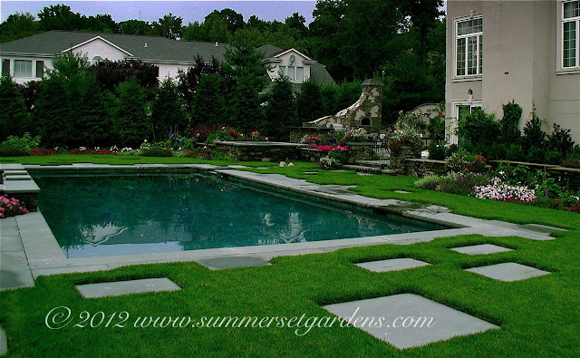 Elegant Outdoor Kitchen In Garden a simple rectangular swimming pool with some interesting details in a new jersey back yard a flagstone and lawn pattern create an elegant pool surround