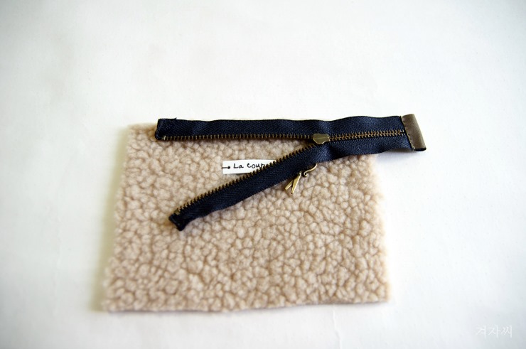 Small cosmetic pouch made of faux fur makeup bag mini wallet. Small cosmetic pouch made of faux fur makeup bag mini wallet.