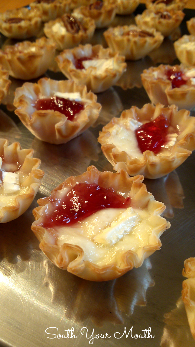 Brie tarts made with mini phyllo cups filled with blackberry jelly or salted pecan and honey.