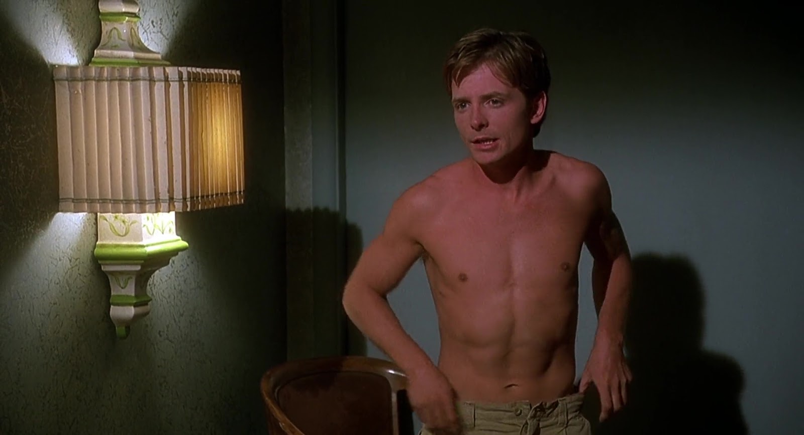 Michael J. Fox nude in Greedy.
