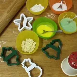 Picture of cookie cutters and coloured icing to decorate Christmas biscuits