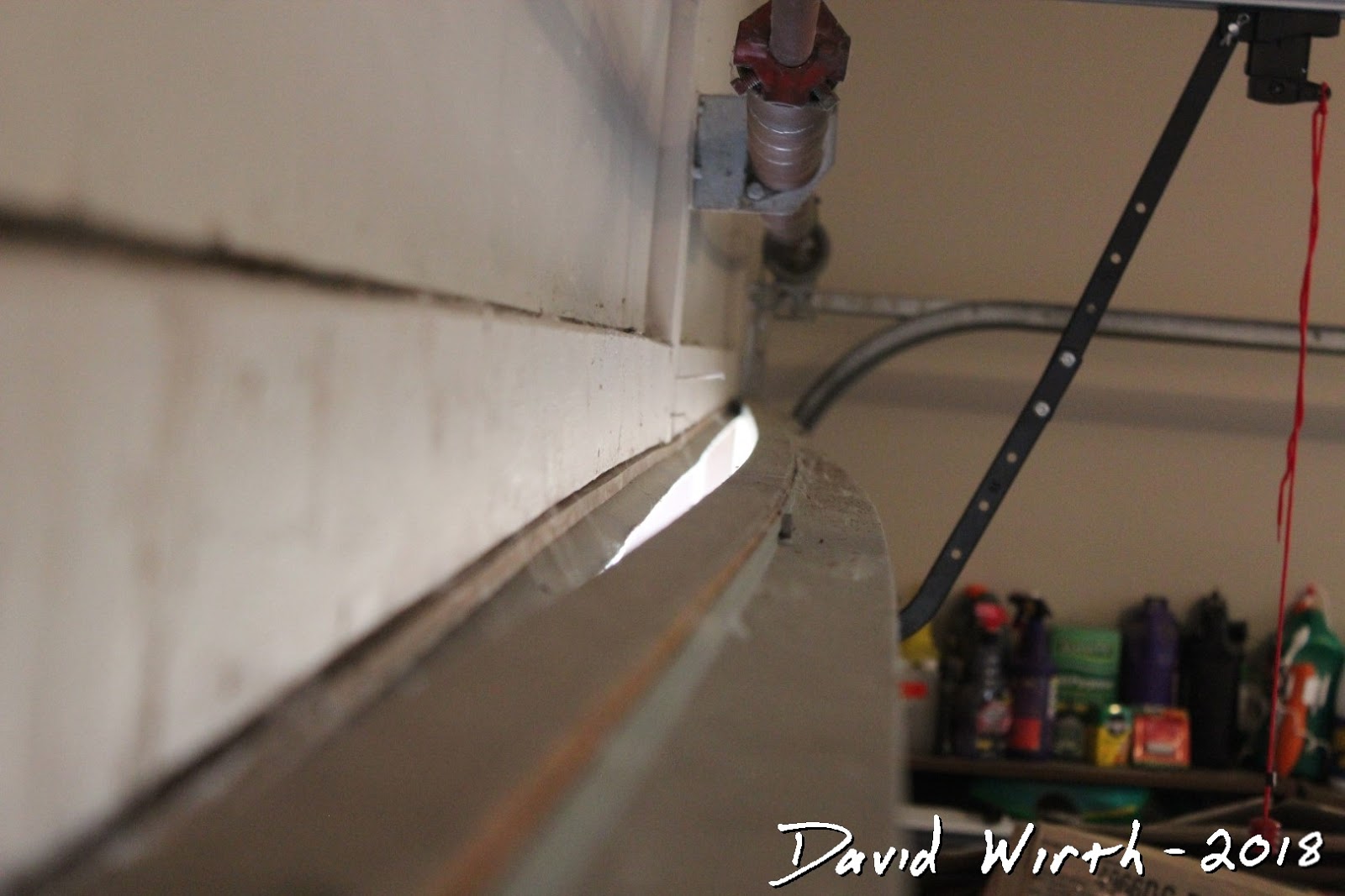 Fix Gap in Sagging Garage Door