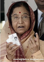 Indian President politician Prathiba Patil after voting election showing dot on finger with election card