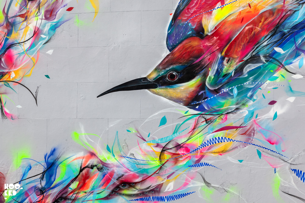 Brazilian street artists L7M paints bird mural in Cheltenham, UK