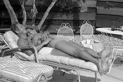 John+Dominis+-+Time+&+Life+Pictures_Getty+Images_Steve+McQueen+and+his+wife+Neile+Adams+lounge+on+the+patio+by+the+pool+at+their+Palm+Springs+bungalow,+1963.jpg