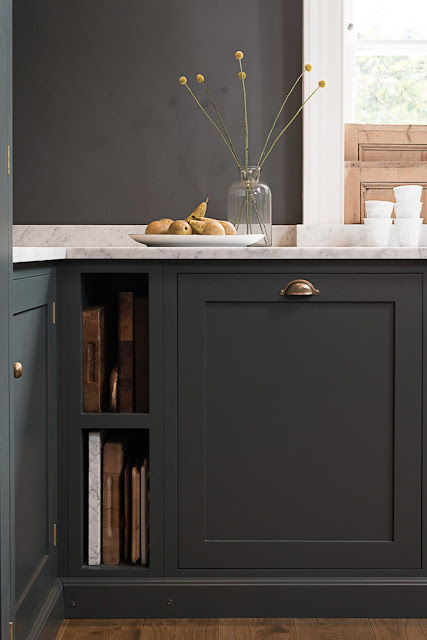 Dark blue-grey cabinets and walls in a luxurious classic London kitchen - found on Hello Lovely Studio