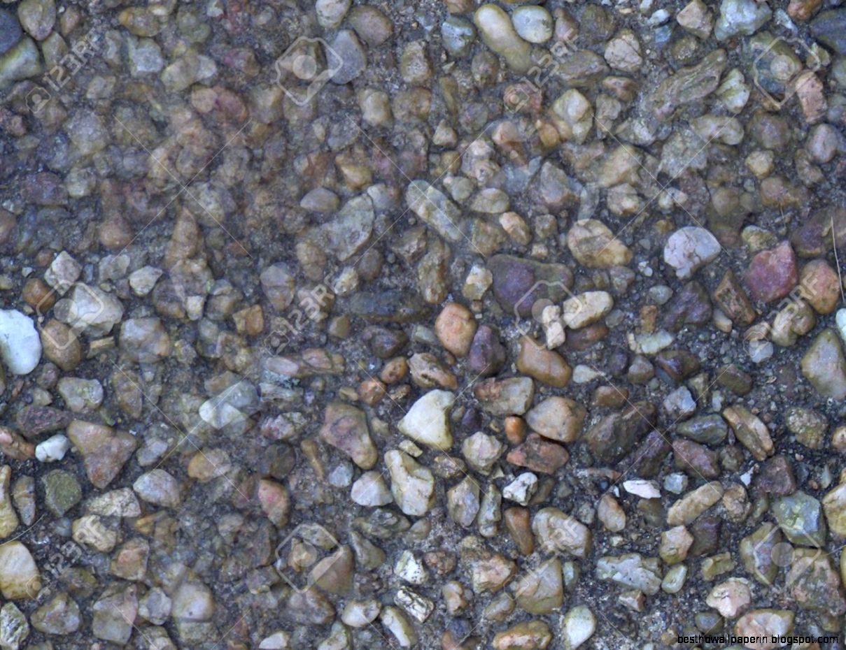 Small Stones Embedded In A Walkway Suitable For Seamless