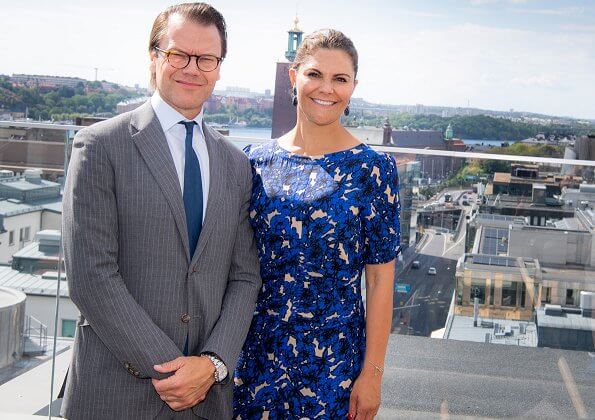 Crown Princess Victoria wore a floral dress by Rodebjer, and navy sandals by Saint Laurent, and blue diamond duchess earrings by Ebba Brahe