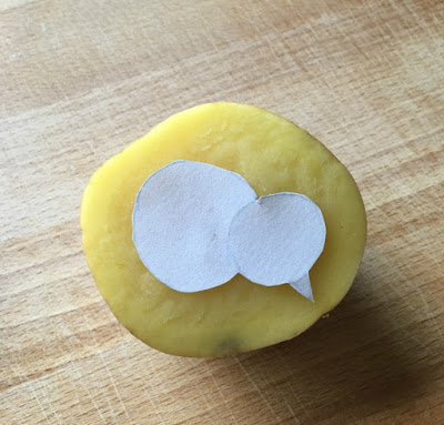 Easy Potato Stamps. half a potato with a template of a chick placed on top