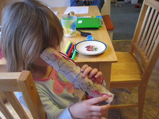 Mabel with a cardboard kaleidoscope