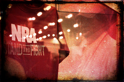 T-shirt on display reads 'NRA -Stand and Fight'