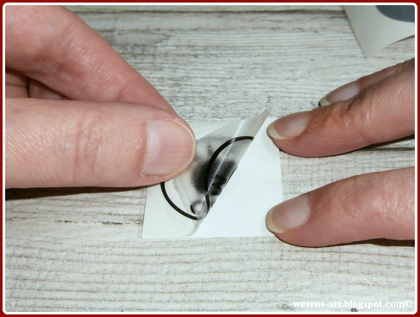 WesensArt applying vinyl onto glass globes