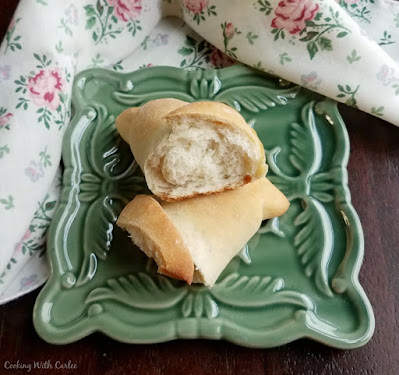 soft inside of golden brown crescent roll inside of a sourdough crescent roll