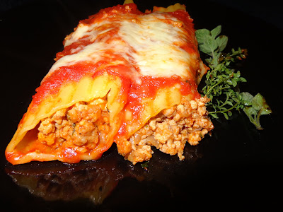 PORK AND CHICKEN MANICOTTI PORTIONS: 3 (6 MANICOTTIS) INGREDIENTS 6 manicottis. Cooked according to manufacturer instructions 1½ tbsp. oil ½ lb. ground pork ½ lb. ground chicken 1 finely chopped small onion. 3 minced garlic cloves 1 tbsp. chopped parsley 1½ tsp. salt ¼ tsp. ground pepper 1 tsp. ground fennel ¾ cups tomato sauce Shredded mozzarella cheese Grated Parmesan cheese METHOD Heat the oil in a frying pan and cook the onions with the garlic, until the onions are translucent. Add and brown pork and chicken together. Season it with parsley, salt, pepper and fennel. Keep cooking for 2 more minutes. Add the tomato sauce and mix. Let it cool off. Fill up the manicottis. Arrange the manicottis in a baking dish with tomato sauce covering the bottom. Cover the manicottis with tomato sauce. Sprinkle with mozzarella and parmesan cheese Cover the dish with plastic wrap and also with aluminum foil. Bake it in a preheated oven at 350 ° F until is hot. Uncover and let brown the cheese a bit.