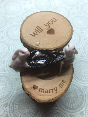 Forever Mark Engagement ring with wooden box and rabbits