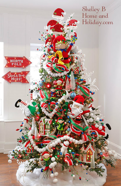 Decorated Christmas tree from the North Pole Village collection by RAZ Imports available for purchase at Shelley B Home and Holiday.com