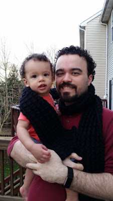 man and baby wrapped in bamboo stitch loom knit scarf