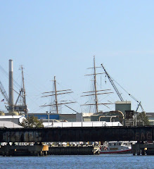 The Coast Guard's tall ship EAGLE appears to be docked behind the bridge. Can't hide her masts.