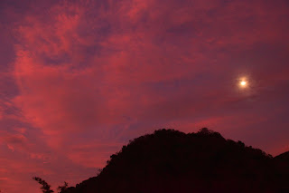 red sunset sky and moon