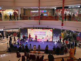 children competing in a game on a stage inside the Mudanjiang Wanda Plaza