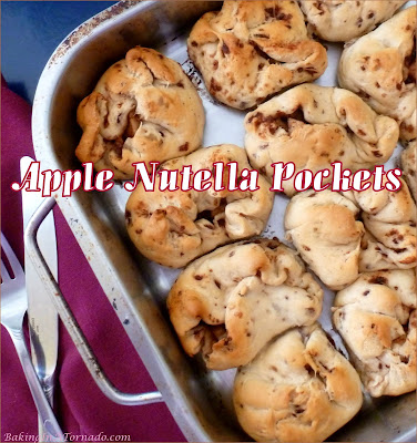 Apple Nutella Pockets start with refrigerator cinnamon roll dough, are stuffed with Nutella and an apple and walnut mixture, then baked in the oven like individual apple pies. | Recipe developed by www.BakingInATornado.com | #recipe #bake