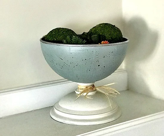 blue pedestal dish with moss balls