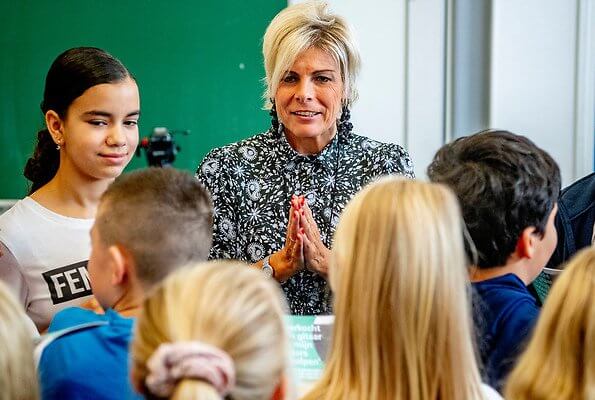 Princess Laurentien attended the launch of a new national education programme at primary school Het Avontuur in Almere. floral print silk dress