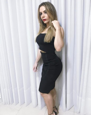 Rebecca Ferrari in black dress