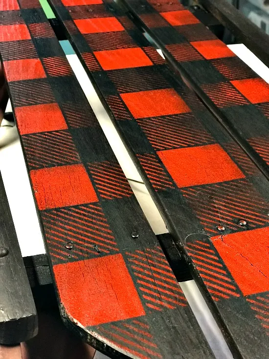 Close up of red buffalo check sled