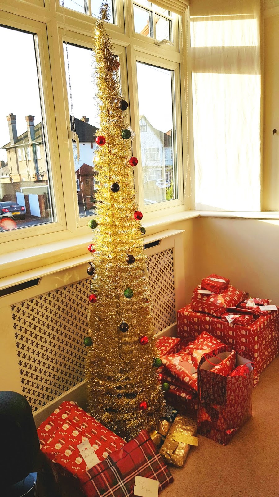 The easiest way to have an artificial Christmas tree. Gold pop up tree from B and Q