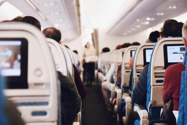 people siting on an air plain