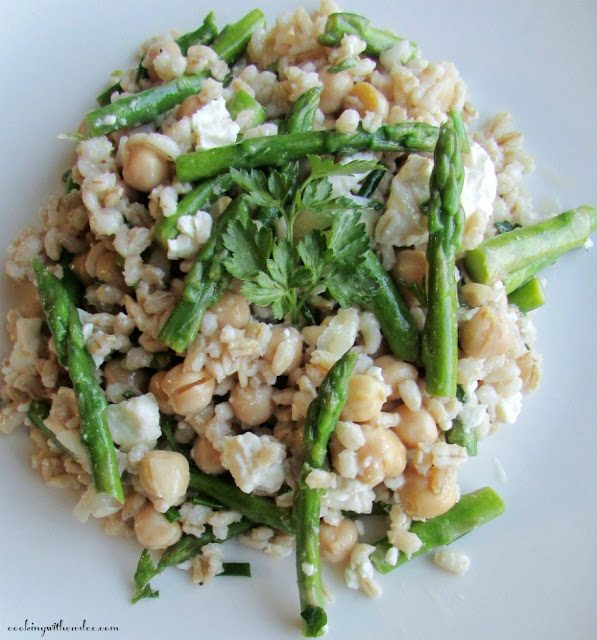 This asparagus, barley and chickpea salad is the perfect hearty side dish. It is bright, fresh and delicious. The leftovers make a fabulous lunch as well! close up of serving of asparagus salad