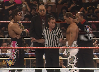 WWE / WWF - WRESTLEMANIA 12 - WWF Champion Bret Hart and Shawn Michaels get instructions from Earl Hebner before their Iron Man Match