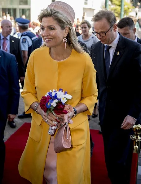 Queen Maxima wore Natan coat in yellow, wore Natan Dress in pink, Natan pumps, Natan clutch handbags, diamond earrings