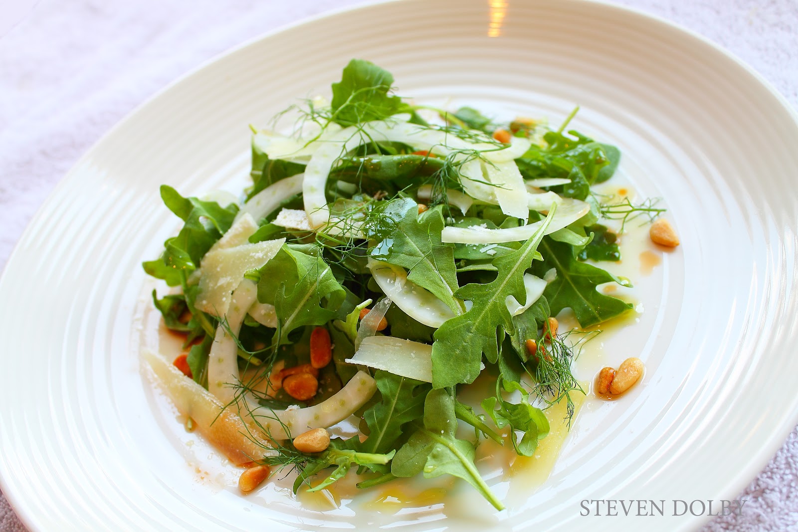 Arugula salad with Fennel, Parmesan, toasted Pine Nuts & Balsamico by