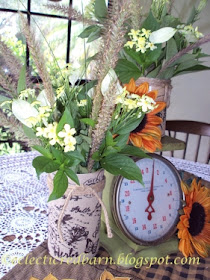 Eclectic Red Barn:Fall centerpiece with burlap wrapped containers. Share NOW. #fallcenterpiece #falldecor #burlap #eclecticredbarn