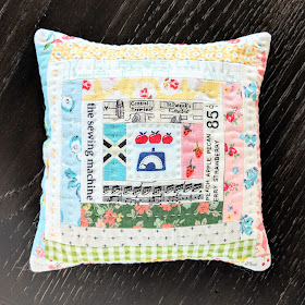 Scrappy Log Cabin Pillow by Heidi Staples of Fabric Mutt