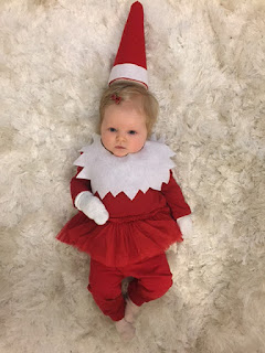 Baby dressed as an elf